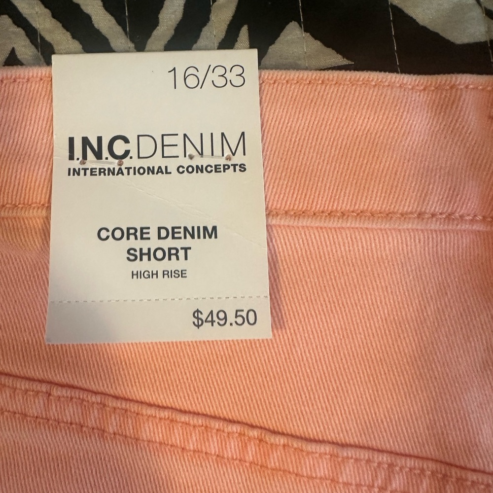 Denim coral colored shorts.  Brand new with tags.  Cute fringe in the bottoms.